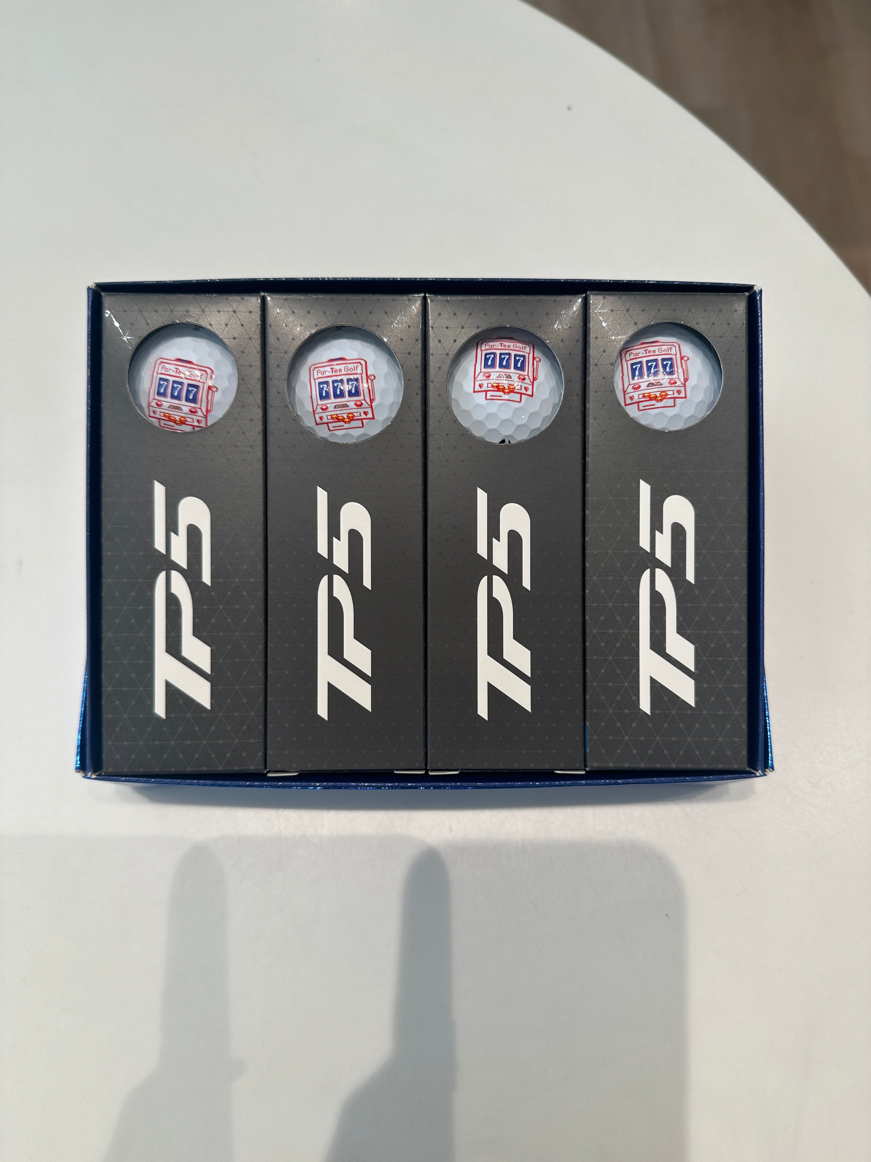 TaylorMade TP5 Par-Tee Golf 7th Anniversary Logo Ball (Dozen)